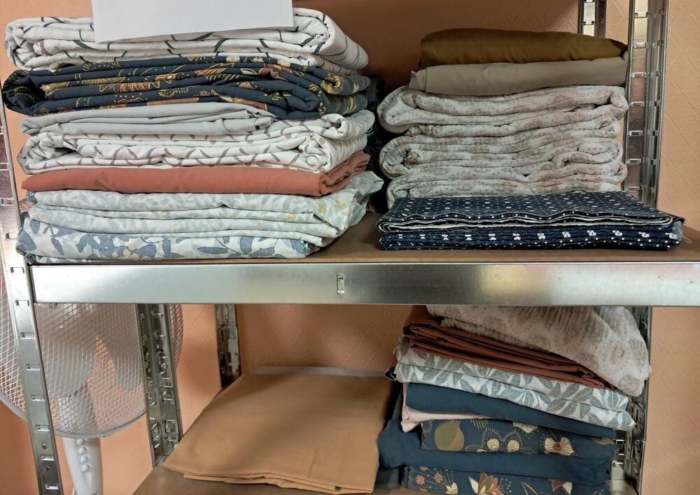 Blanchisserie - Piles de linges